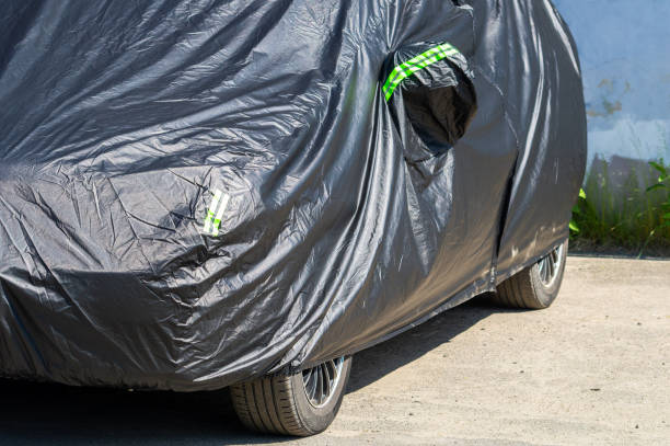 istock A car covered with a black cover 1563026731