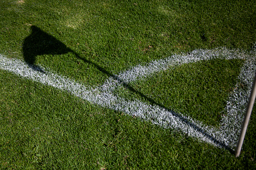Shadow of soccer flag in the corner