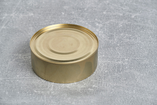 Monochrome image of opened soup can with white background.