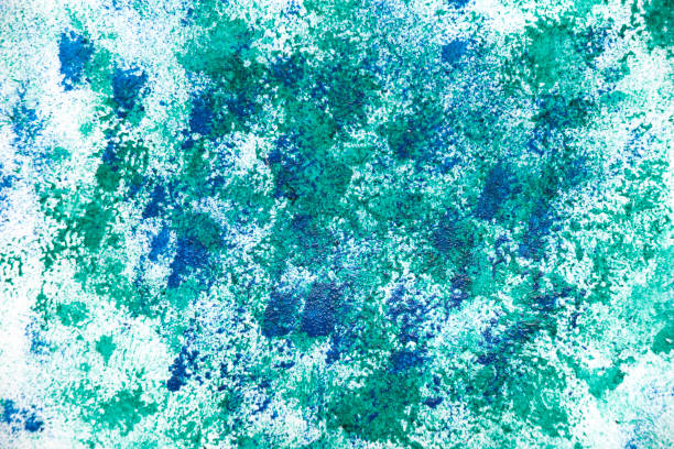 istock Abstract blue background with green paint white background. 1563032294
