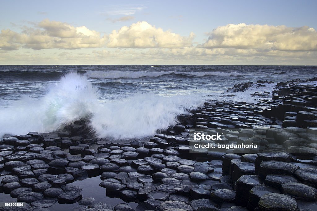 Waves splashing on stones from the Giant's Causeway Waves splashing on the great hexagon stones of the Giant's Causeway from the Antrim coast, Northern Ireland. Basalt Stock Photo