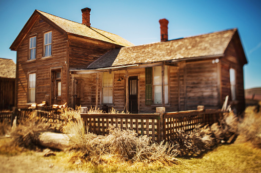 Como, Colorado, USA - February 12, 2024: An old wooden wagon sits in the yard of a home in the historic town of Como, a former coal mining and railway center during the late 1800s.