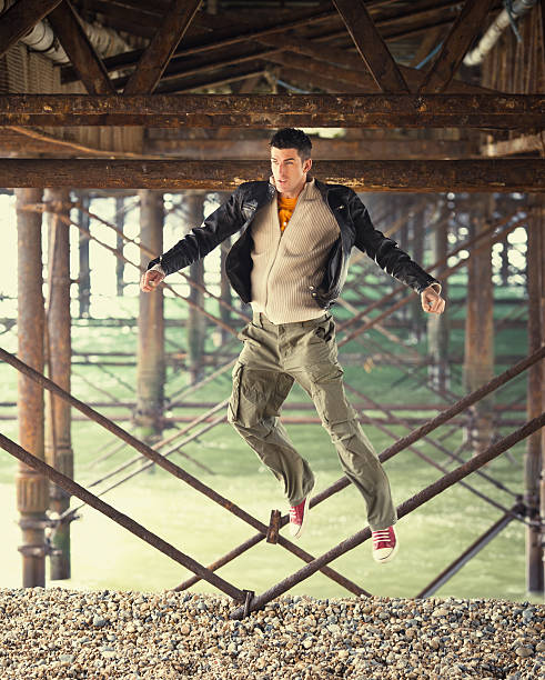 istock young man jumping and goofing around 156304153