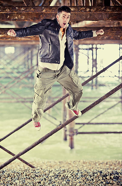 istock young man jumping and goofing around 156304164