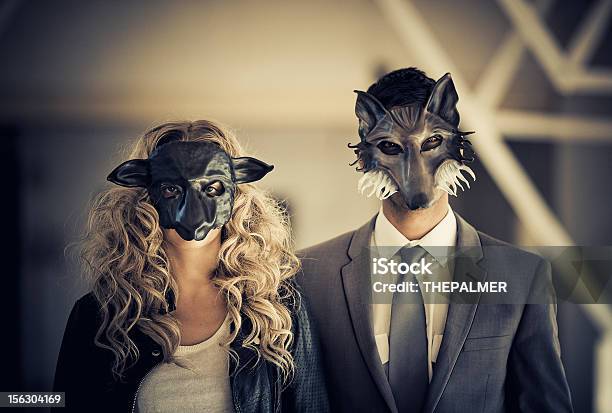 Young Couple Wearing Animal Mask Stock Photo - Download Image Now - Wolf, Mask - Disguise, Men