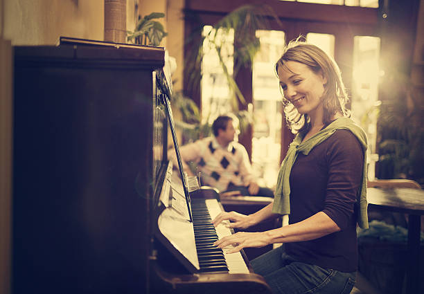 istock woman playing the piano 156304206
