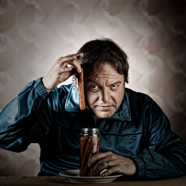 istock Lonely spooky man eating in dingy enviroment. 156306808