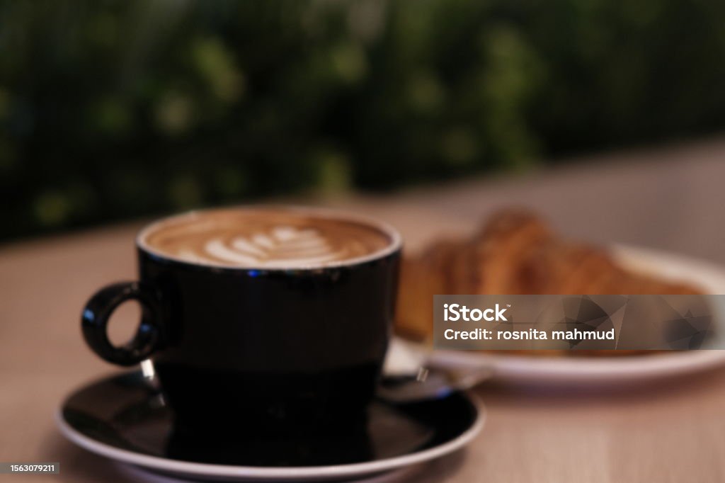 selective focus of cappucino with latte art and croissant Bakery Stock Photo