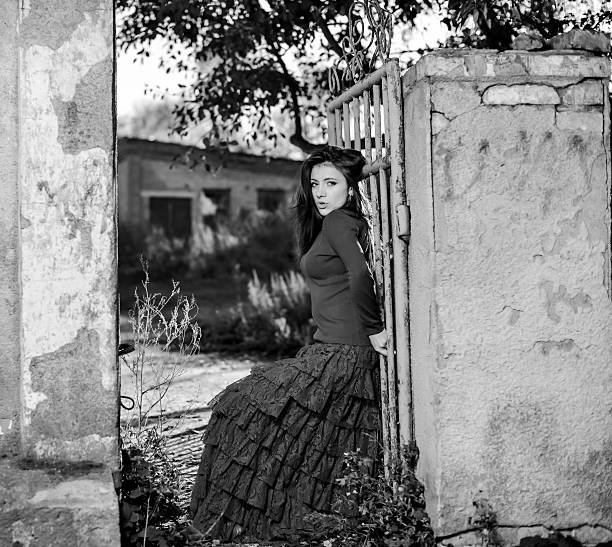 istock stilish woman at old gate 156311845