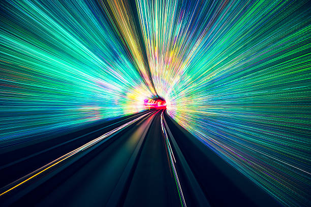 Futuristic railroad Abstract blurred tunnel with light end of the line stock pictures, royalty-free photos & images