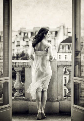 Woman on a balcony, strong grain and texture added http://www.lisegagne.com/lightboxes/paris.jpg