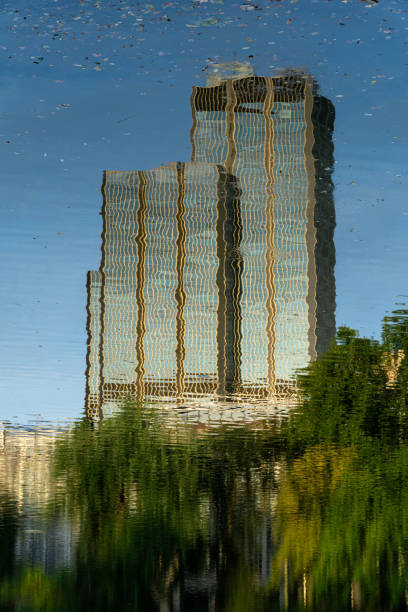 Abstract reflections of building on water with ripples