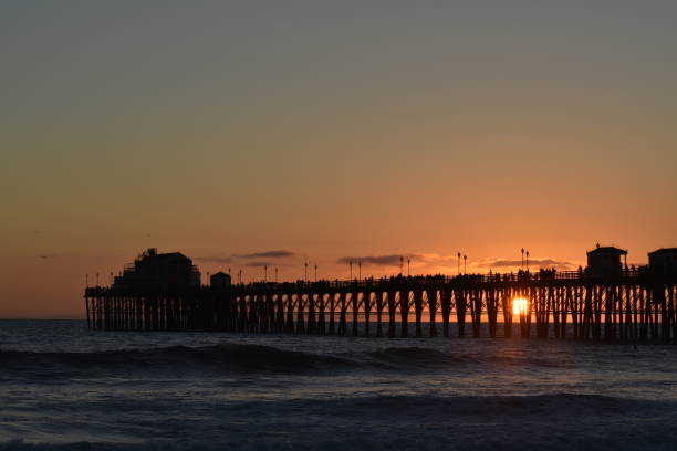 istock Sunset at Oceanside, California Beach Pier 1563195668