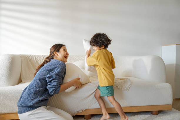 istock Mother and little son doing housekeeping activities together. 1563228423