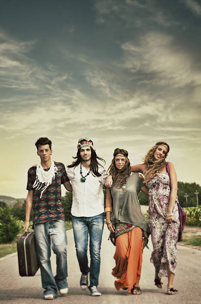 Hippies walking on the road. 1970s style. Age effects added.