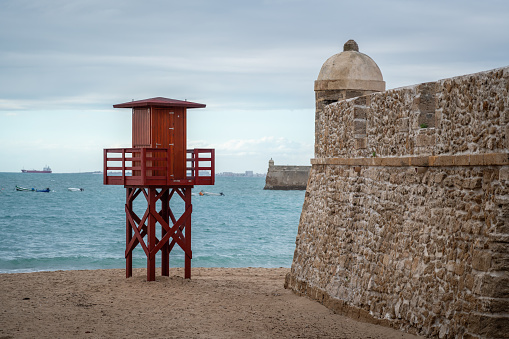 Orejon Bastion and Lifeguard Tower at La Caleta Beach - Cadiz, Andalusia, Spain