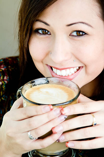istock Beautiful Girl Drinking Latte 156325185