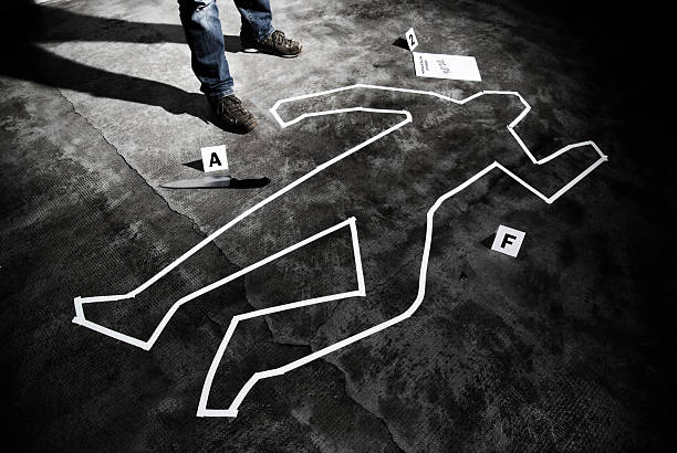 Murderer back on the crime scene Murderer back on the crime scene - Forensic science crime scene stock pictures, royalty-free photos & images