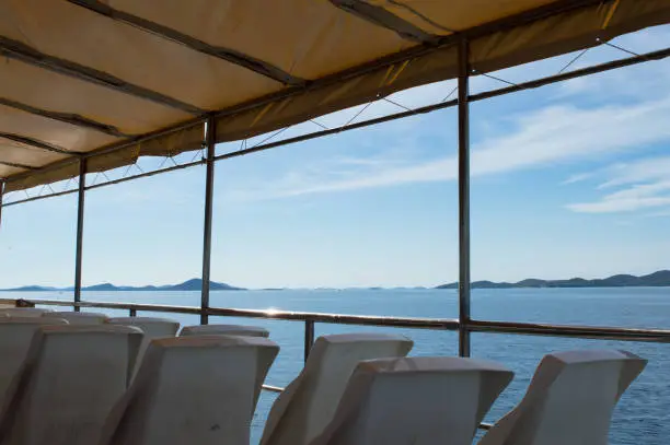 Empty passengers seats on a ferry boat in Dalmatia, Zadar region, Adriatic sea