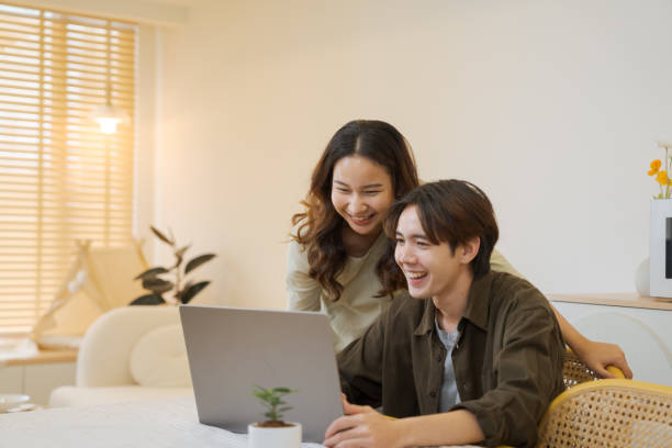 istock Boyfriend makes an online booking at home. 1563269951