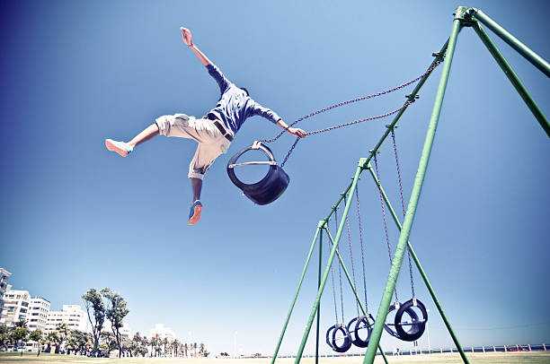 Free Running Parkour Cape Town Free Runner performing a big aerial stunt in Cape Town Sea Point park swings. South Africa. parkour sequence stock pictures, royalty-free photos & images
