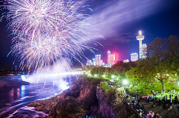 Niagara Falls fireworks Niagara Falls fireworks and light show at dusk on Victoria day, National Holiday in Canada. victoria day canada photos stock pictures, royalty-free photos & images