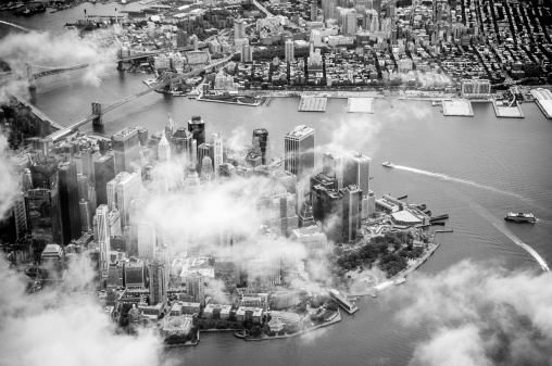 Aerial view of Manhattan among clouds, New York.