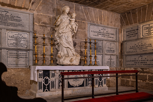 Cadiz, Spain - Apr 9, 2019: Bishops Chapel with Virgin of the Rosary Marble Statue at the Crypt of Cadiz Cathedral - Cadiz, Andalusia, Spain