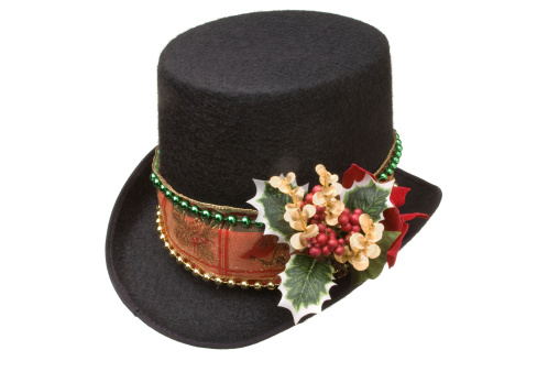 A black top hat decorated for Christmas.