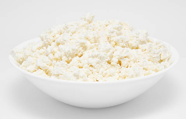 istock Fresh cottage cheese in the bowl isolated 156333965