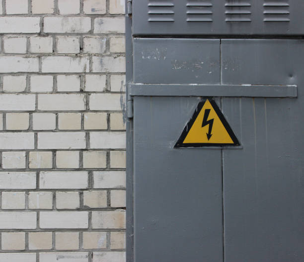 istock High Voltage Sign On A Steel Door On A White Brick Wall Texture Background 1563339982