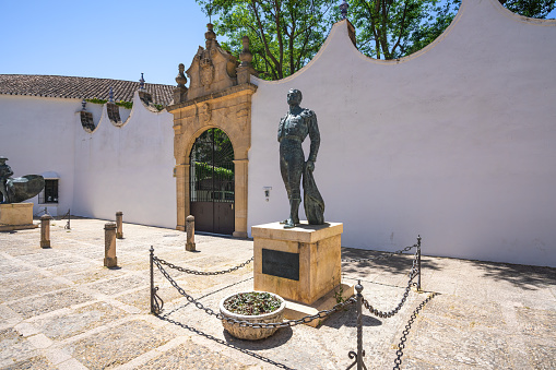 Ronda, Spain - May 14, 2019: Bullfighter Antonio Ordonez Statue at Plaza de Toros (Ronda Bullring) - Ronda, Andalusia, Spain