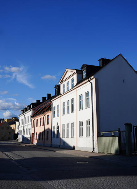 istock Low angle view of buildings against blue sky 1563389246