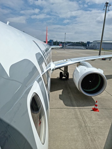 The image shows a helvetic airways aricraft seen from the door during the boarding procedure at airport Zurich.