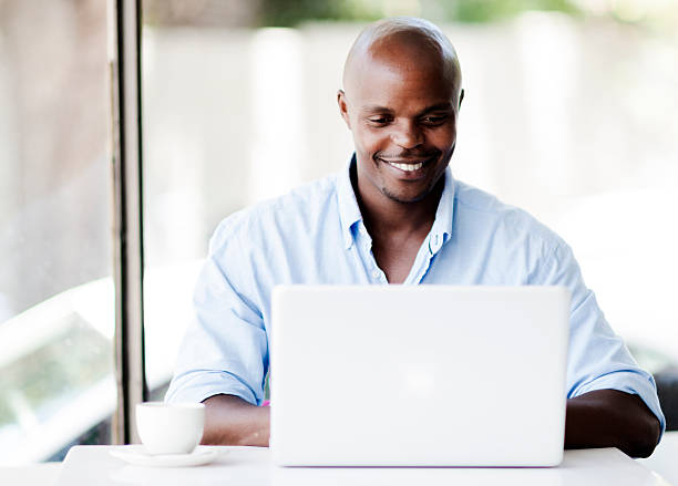 istock Happy man working on laptop in the cafe 156342535