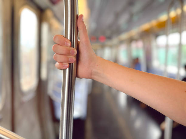 istock The hand holding the railing in the subway 1563430869