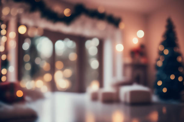Beautiful cozy background image of a decorated room with a Christmas tree. Beautiful blurred interior of a living room decorated for Christmas in warm cozy brown tones. Christmas tree, lights and gifts out of focus. images of decorated christmas trees stock pictures, royalty-free photos & images