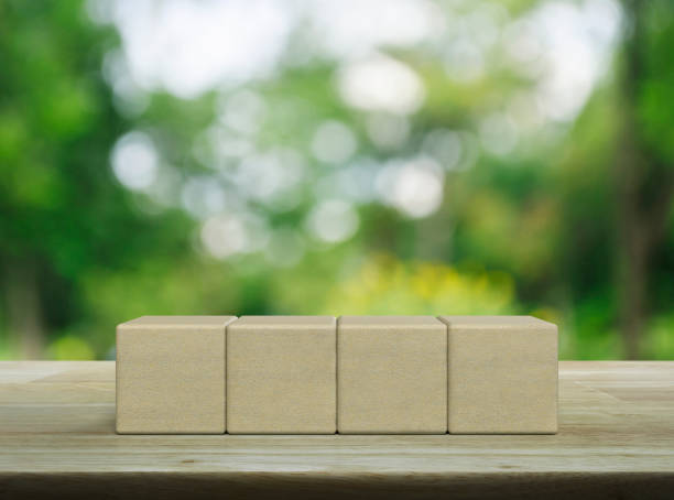 istock Four wood block cubes on wooden table 1563462372