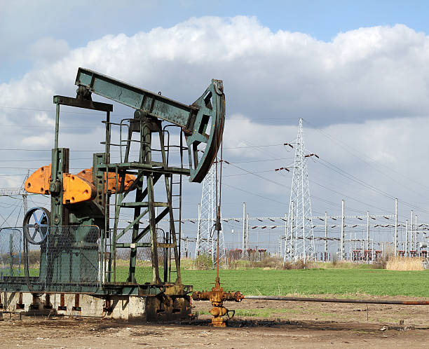 istock oil field with pumpjack 156346618