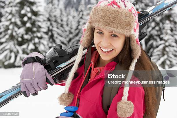 Teenage Girl On Ski Holiday In Mountains Stock Photo - Download Image Now - 14-15 Years, Activity, Alpine Skiing