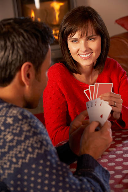 istock Couple Playing Cards By Cosy Log Fire 156350105