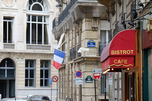 Paris,France,April 9th 2022: Locals and tourists enjoying. the sidewalk cafe in Paris. Paris is famous for its cafeteria culture to the world.
