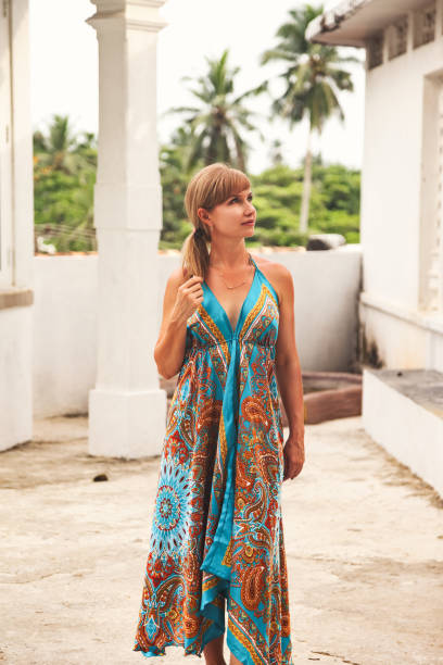 portrait of traveler lady 50 years old visits sri lankan buddhist temple. lovely woman in ancient city with buddhist heritage, religion and culture. summer vacation holiday concept. copy ad text space - 45 50 years portrait mature women one mature woman only imagens e fotografias de stock