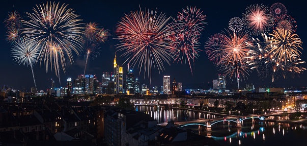 A vibrant night sky illuminated with a mesmerizing display of colorful fireworks in Frankfurt, Germany