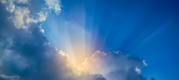 Blue sky and sunlight coming through the cloud SUN OF GOD LIGHT.