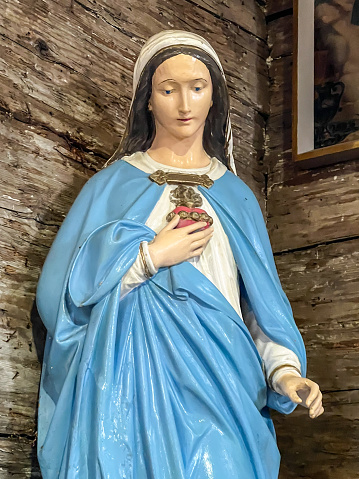 Ksiezy Las, Poland, July 1, 2023:  The  old (1494) wooden church of St. Michael the Archangel in Ksiezy Las in Silesia. Inside, the figure of the heart of the Blessed Virgin Mary.