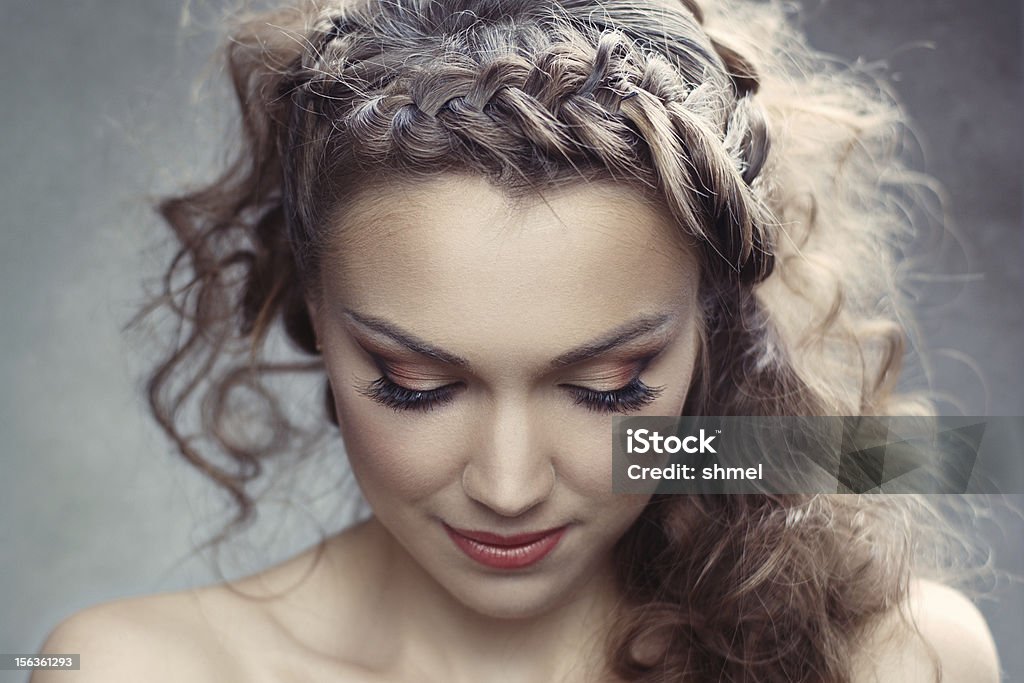 Pretty woman with curly hair A pretty woman with curly hair Adolescence Stock Photo