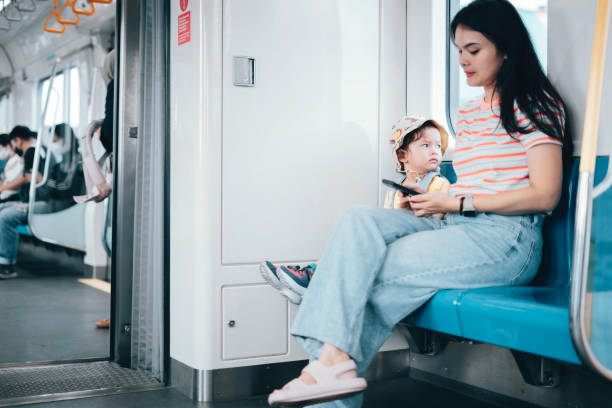 istock Asian Mother and son traveling by train 1563658281