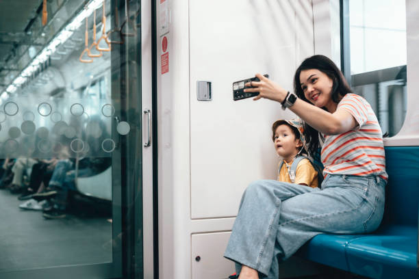 istock Asian Mother and son traveling by train 1563660430