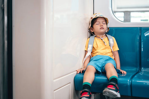 pre-school student sleeping on the train
